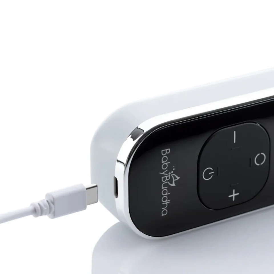 Close-up of the BabyBuddha 3.0 motor with its USB-C charging cable connected.