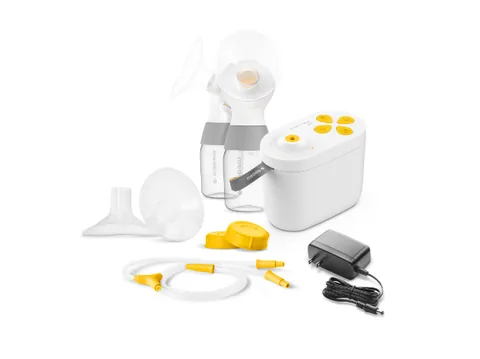 Medela Pump In Style Pro motor, collection parts, tubing and AC power adapter.