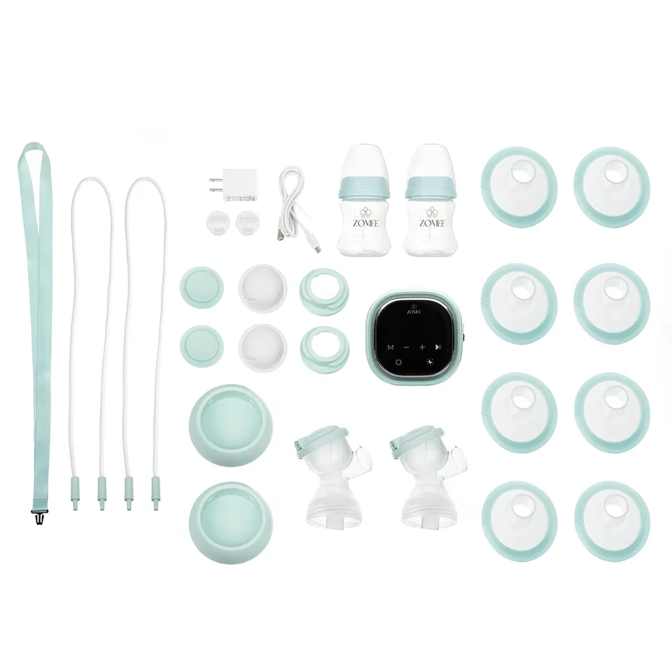 Zomee Z2 motor, bottles, tubing, charging accessories and collection parts laid out separately